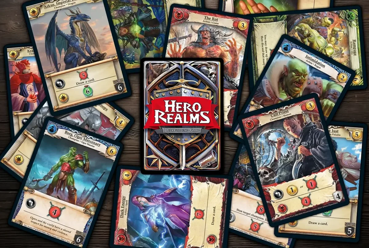 Hero Realms cards spread across a wooden table